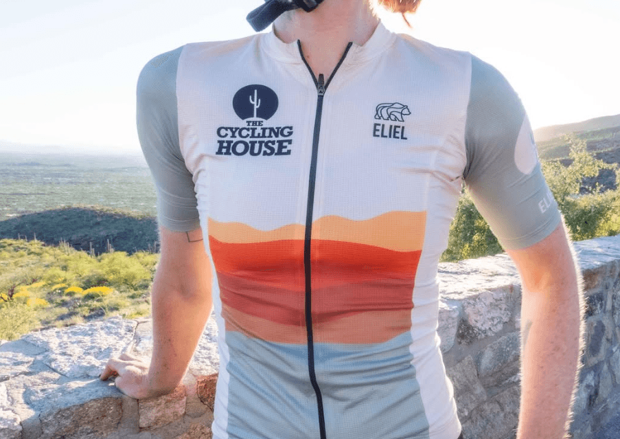 Close-up of The Cycling House jersey with layered desert-inspired graphics