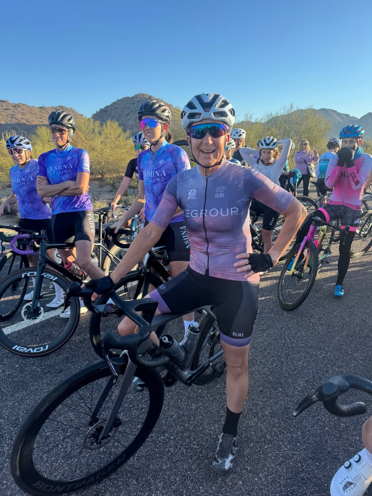 Rider wearing the purple Regroup kit at a desert group ride