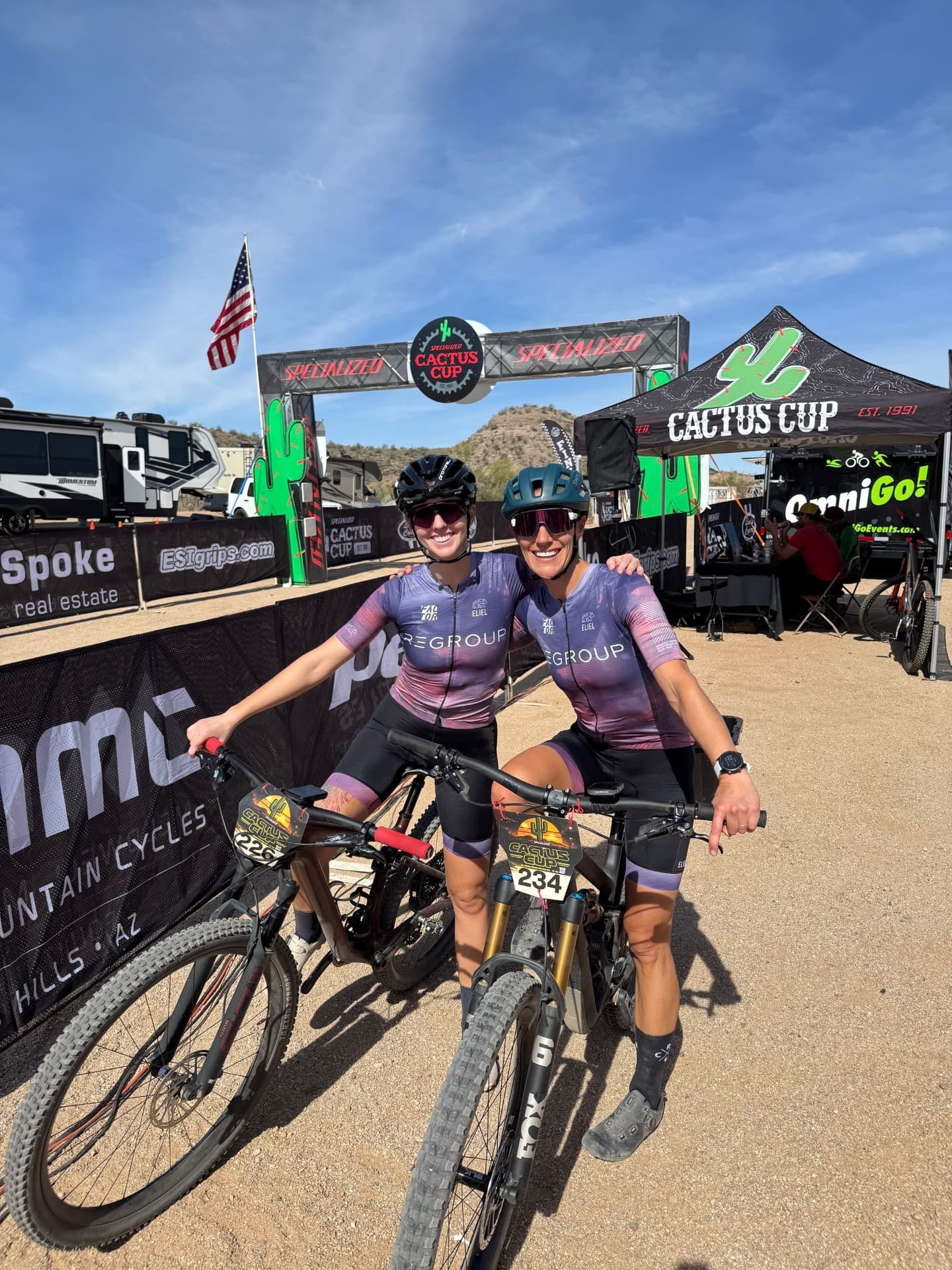 Two Regroup riders with mountain bikes at the Cactus Cup